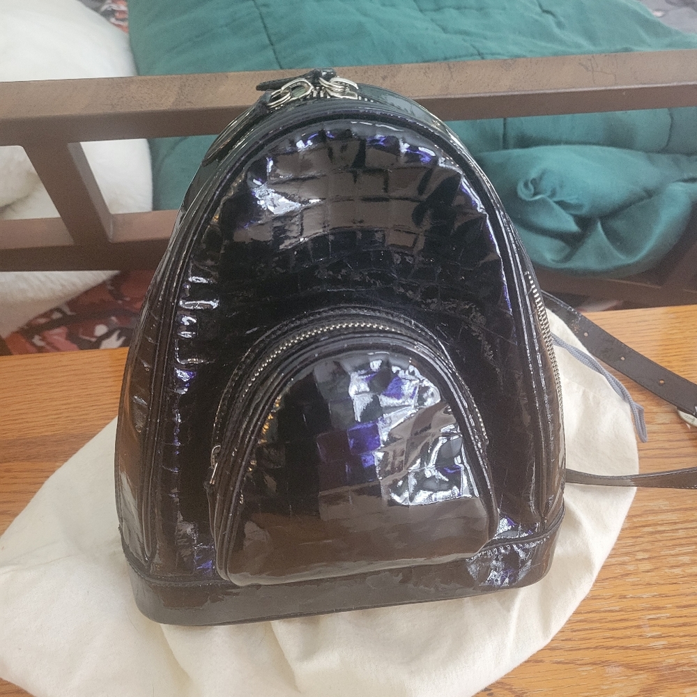 A great Gucci black patent leather crossbody backpack!